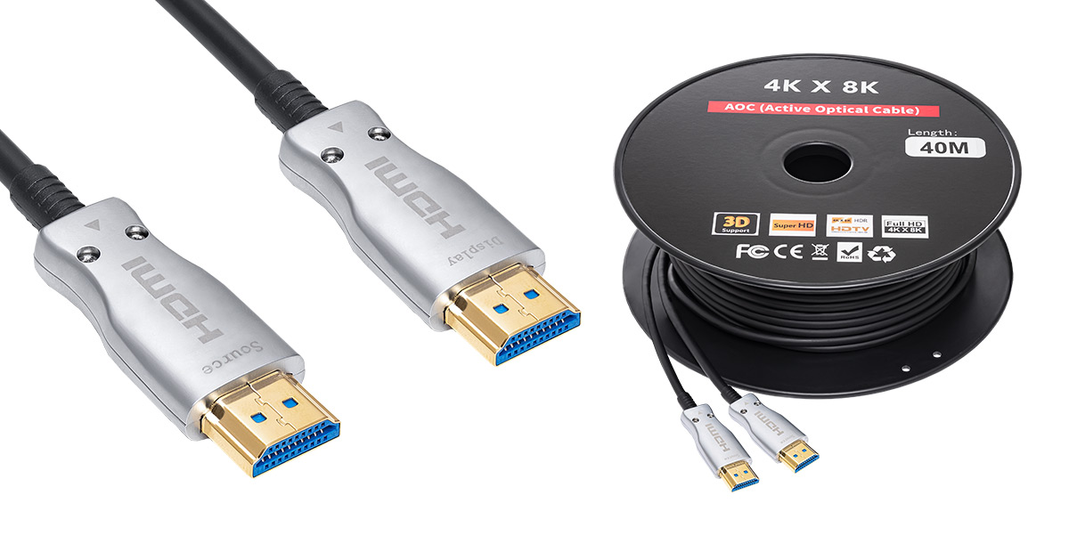 zbliżenie na dwie wtyczki kabla HDMI oraz rolka zwiniętego 40m kabla HDMI